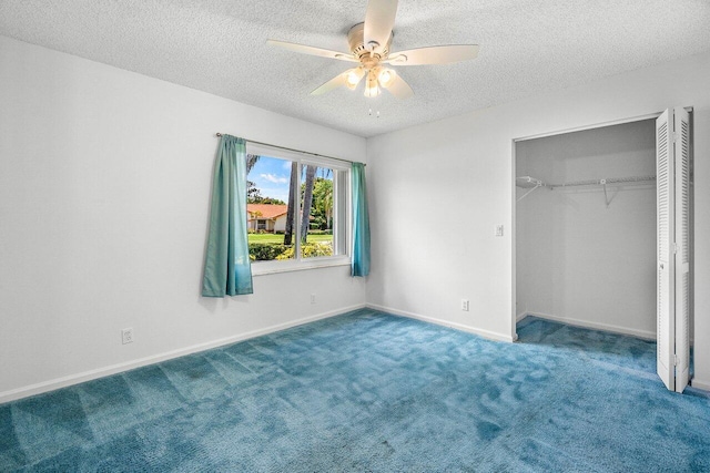 145 Waterway Rd, Royal Palm Beach, FL 33411 - unfurnished bedroom featuring a textured ceiling, a closet, carpet floors, and a ceiling fan