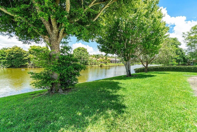 145 Waterway Rd, Royal Palm Beach, FL 33411 - view of grassy yard with a water view