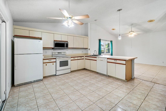 145 Waterway Rd, Royal Palm Beach, FL 33411 - kitchen with white appliances, lofted ceiling, ceiling fan, a textured ceiling, and a peninsula