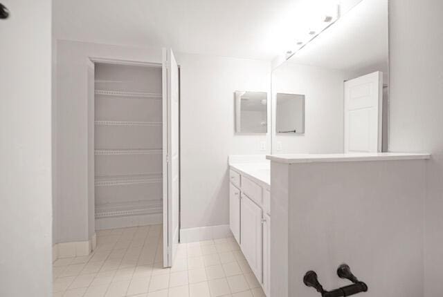 11765 W Atlantic Blvd Unit 1626, Coral Springs, FL 33071 - bathroom featuring vanity and baseboards
