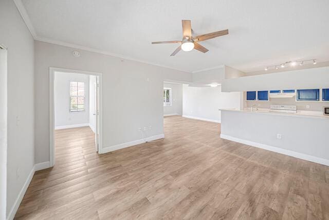 11765 W Atlantic Blvd Unit 1626, Coral Springs, FL 33071 - unfurnished living room featuring ornamental molding, a ceiling fan, light wood-type flooring, and rail lighting