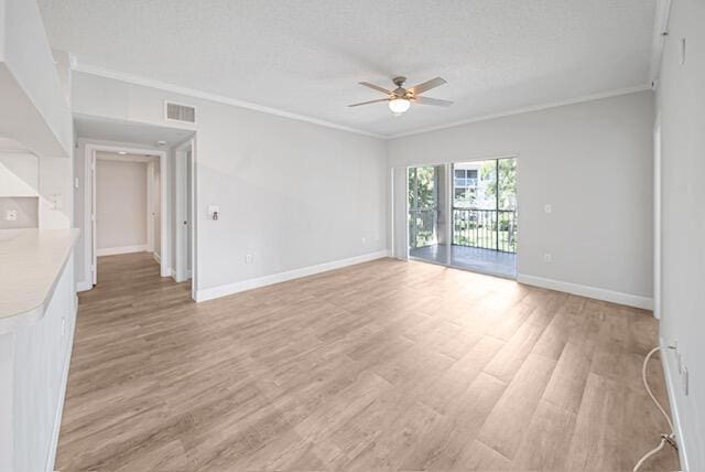 11765 W Atlantic Blvd Unit 1626, Coral Springs, FL 33071 - empty room with a ceiling fan, crown molding, light wood finished floors, and a textured ceiling