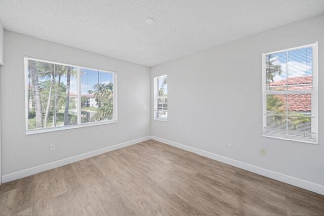 11765 W Atlantic Blvd Unit 1626, Coral Springs, FL 33071 - unfurnished room with wood finished floors