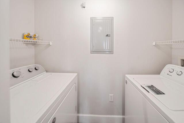 11765 W Atlantic Blvd Unit 1626, Coral Springs, FL 33071 - laundry room with electric panel and washer and clothes dryer