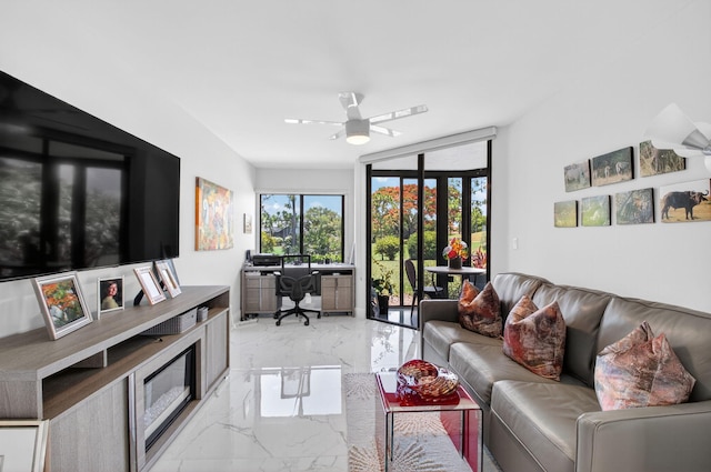 15822 Loch Maree Ln Unit 3203, Delray Beach, FL 33446 - living room with light marble finish floors, a desk, and a ceiling fan