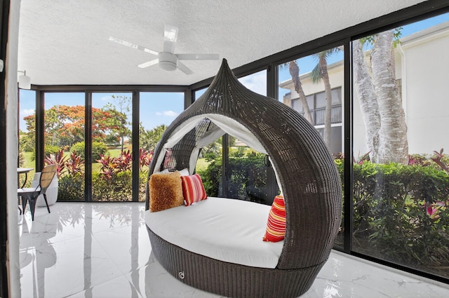 15822 Loch Maree Ln Unit 3203, Delray Beach, FL 33446 - sunroom featuring marble tiled flooring, plenty of natural light, a textured ceiling, and a wall of windows