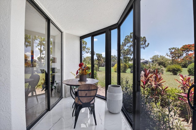 15822 Loch Maree Ln Unit 3203, Delray Beach, FL 33446 - sunroom / solarium featuring a textured ceiling, marble tiled floors, a wall of windows, and a textured wall
