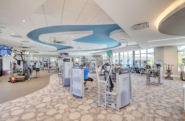 15822 Loch Maree Ln Unit 3203, Delray Beach, FL 33446 - gym with carpet flooring, a ceiling fan, and a raised ceiling