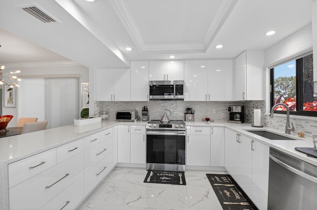 15822 Loch Maree Ln Unit 3203, Delray Beach, FL 33446 - kitchen with appliances with stainless steel finishes, crown molding, light marble finish floors, modern cabinets, and white cabinetry