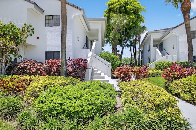 15822 Loch Maree Ln Unit 3203, Delray Beach, FL 33446 - view of front facade featuring stairs and stucco siding