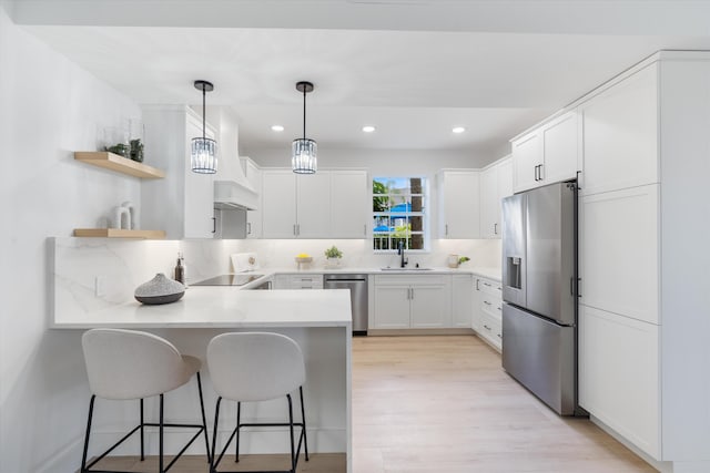 5189 Lake Catalina Dr Unit A, Boca Raton, FL 33496 - kitchen featuring stainless steel appliances, a peninsula, white cabinetry, open shelves, and recessed lighting