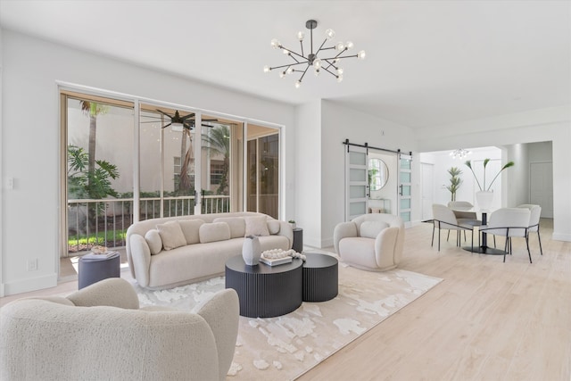5189 Lake Catalina Dr Unit A, Boca Raton, FL 33496 - living room with a chandelier, a barn door, wood finished floors, and ceiling fan