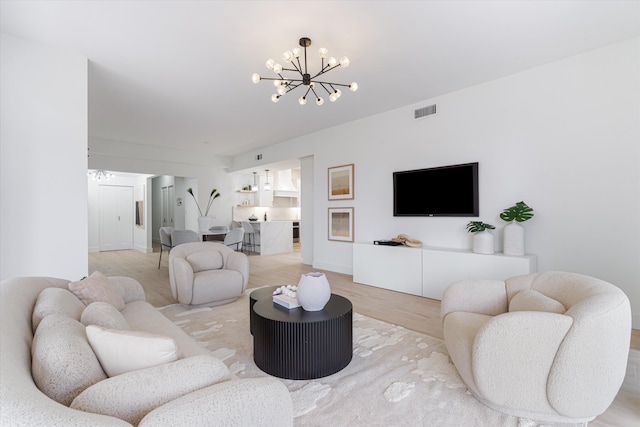 5189 Lake Catalina Dr Unit A, Boca Raton, FL 33496 - living area featuring a chandelier and light wood finished floors