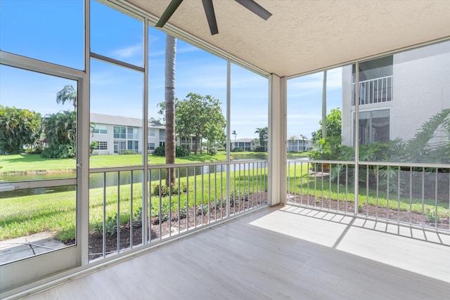 5189 Lake Catalina Dr Unit A, Boca Raton, FL 33496 - unfurnished sunroom featuring a water view, ceiling fan, and a residential view
