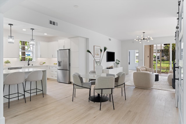 5189 Lake Catalina Dr Unit A, Boca Raton, FL 33496 - dining area featuring a chandelier, light wood finished floors, and recessed lighting