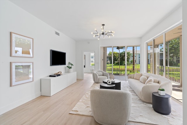 5189 Lake Catalina Dr Unit A, Boca Raton, FL 33496 - living area featuring a chandelier and light wood-type flooring