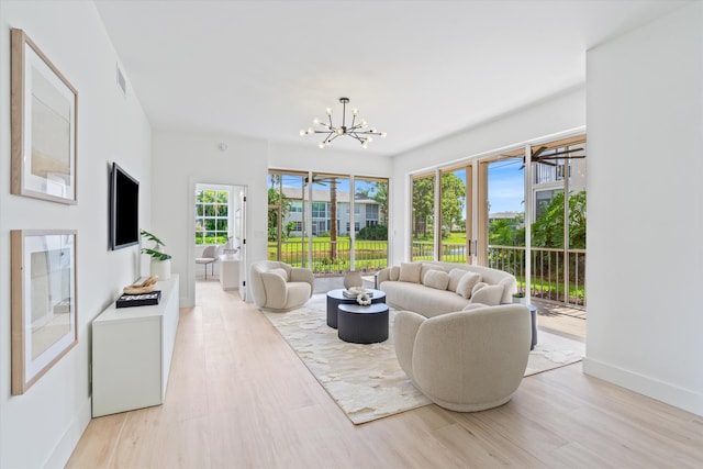 5189 Lake Catalina Dr Unit A, Boca Raton, FL 33496 - living area with a chandelier and light wood-style flooring