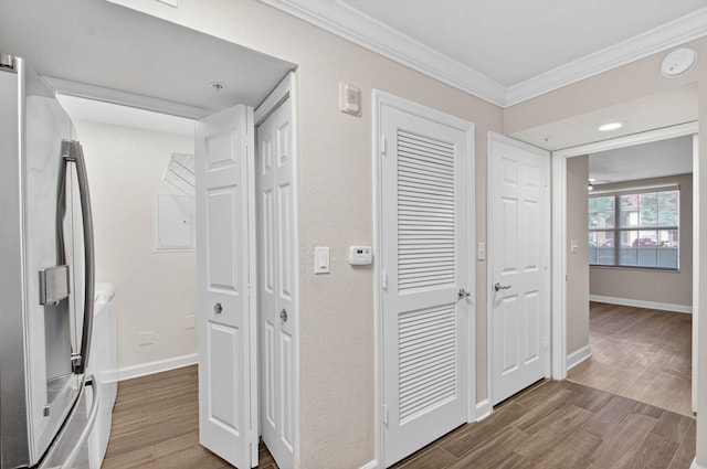 15155 Michelangelo Blvd Unit 103, Delray Beach, FL 33446 - hall featuring crown molding, washer and dryer, wood finished floors, and electric panel