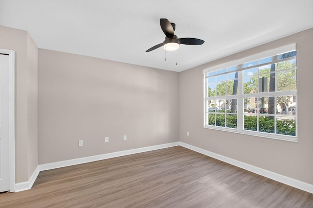 15155 Michelangelo Blvd Unit 103, Delray Beach, FL 33446 - empty room with light wood-style floors and ceiling fan
