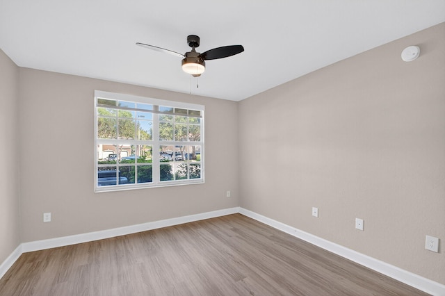 15155 Michelangelo Blvd Unit 103, Delray Beach, FL 33446 - spare room with wood finished floors, a ceiling fan, and a smoke detector