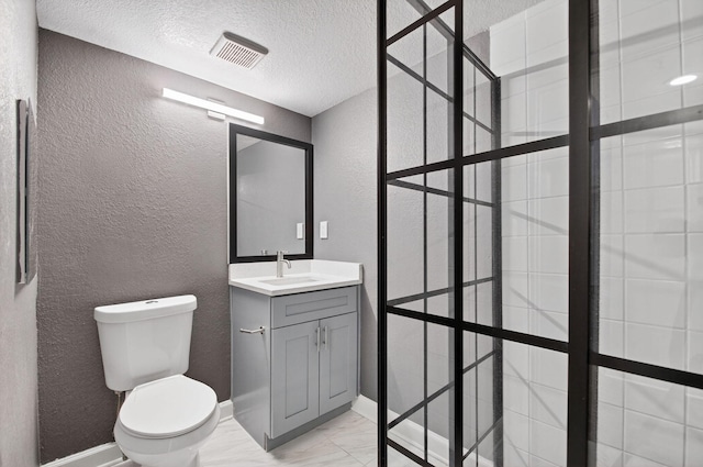 15155 Michelangelo Blvd Unit 103, Delray Beach, FL 33446 - bathroom featuring a textured wall, marble look tile flooring, vanity, a textured ceiling, and a tile shower
