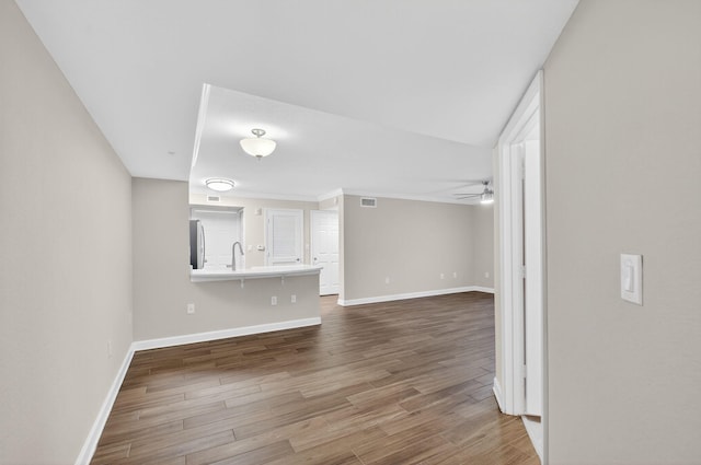 15155 Michelangelo Blvd Unit 103, Delray Beach, FL 33446 - unfurnished living room with dark wood finished floors and a ceiling fan