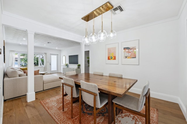 1116 SE 11th St, Fort Lauderdale, FL 33316 - dining area featuring ornate columns, wood finished floors, recessed lighting, and crown molding