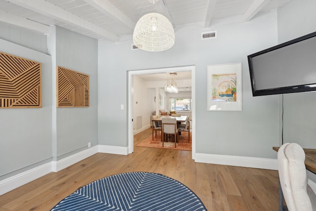 1116 SE 11th St, Fort Lauderdale, FL 33316 - hallway with a chandelier, beam ceiling, and hardwood / wood-style floors