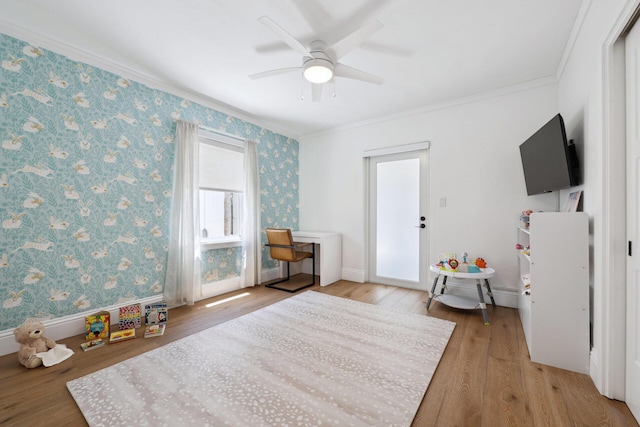 1116 SE 11th St, Fort Lauderdale, FL 33316 - living area featuring ornamental molding, light wood-type flooring, wallpapered walls, and a ceiling fan