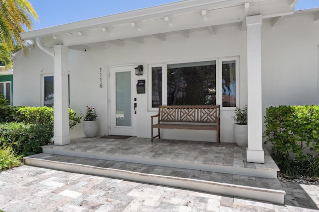 1116 SE 11th St, Fort Lauderdale, FL 33316 - property entrance with stucco siding and covered porch