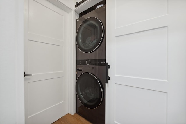1116 SE 11th St, Fort Lauderdale, FL 33316 - laundry room featuring estacked washer and dryer and light wood-type flooring