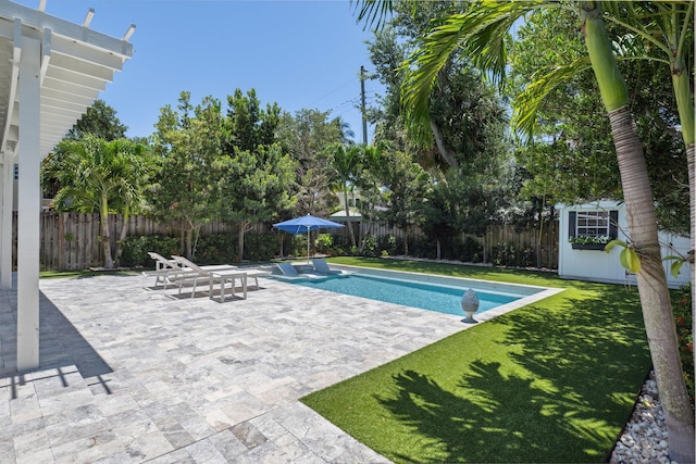 1116 SE 11th St, Fort Lauderdale, FL 33316 - view of swimming pool with a fenced backyard, a patio, and an outbuilding
