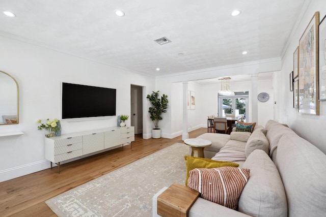 1116 SE 11th St, Fort Lauderdale, FL 33316 - living room featuring ornate columns, recessed lighting, ornamental molding, and wood finished floors