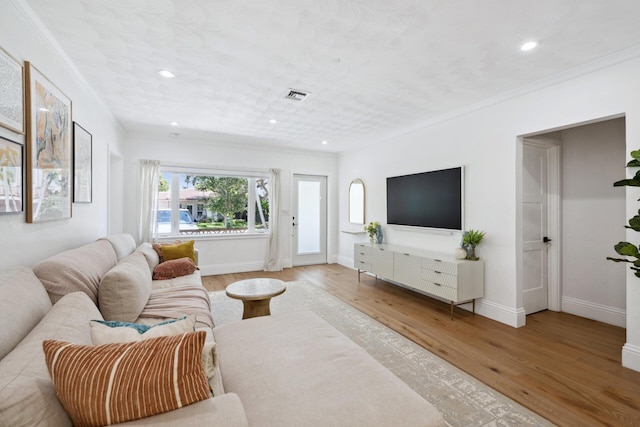 1116 SE 11th St, Fort Lauderdale, FL 33316 - living room featuring wood finished floors, crown molding, and recessed lighting