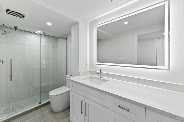 899 Jeffery St Unit 208, Boca Raton, FL 33487 - full bathroom with vanity, a stall shower, recessed lighting, and wood finished floors