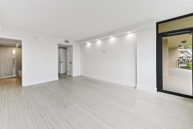 899 Jeffery St Unit 208, Boca Raton, FL 33487 - spare room featuring baseboards