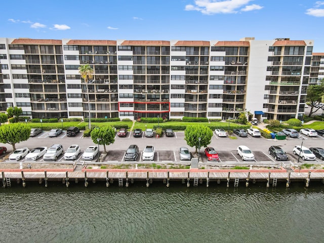 899 Jeffery St Unit 208, Boca Raton, FL 33487 - view of apartment building / complex with uncovered parking and a water view