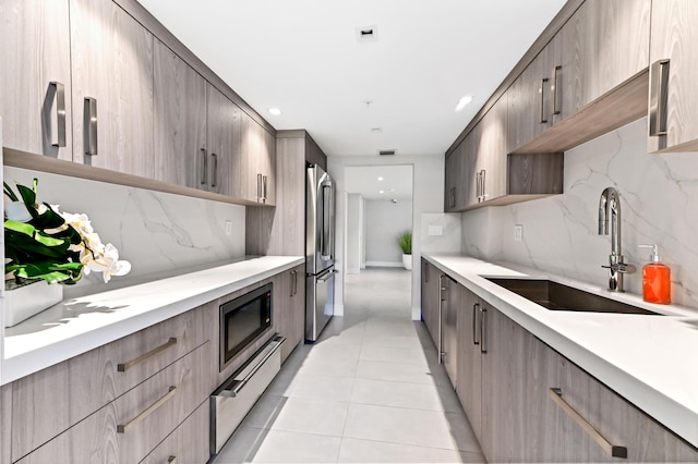 899 Jeffery St Unit 208, Boca Raton, FL 33487 - kitchen with stainless steel appliances, modern cabinets, and decorative backsplash