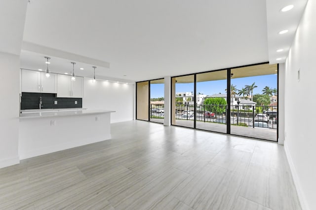 899 Jeffery St Unit 208, Boca Raton, FL 33487 - unfurnished living room with floor to ceiling windows and recessed lighting