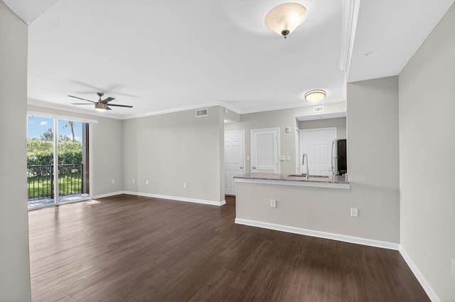 15045 Michelangelo Blvd Unit 104, Delray Beach, FL 33446 - unfurnished living room featuring dark wood-style floors, ceiling fan, and crown molding