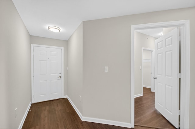 15045 Michelangelo Blvd Unit 104, Delray Beach, FL 33446 - hall with dark wood-type flooring and baseboards