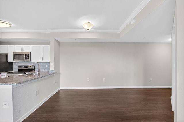 15045 Michelangelo Blvd Unit 104, Delray Beach, FL 33446 - kitchen featuring stainless steel microwave, range with electric stovetop, white cabinets, tasteful backsplash, and dark wood-type flooring