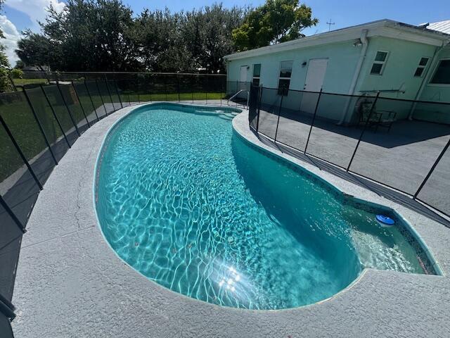 1910 SE Rainier Rd, Port Saint Lucie, FL 34952 - view of pool with a patio area