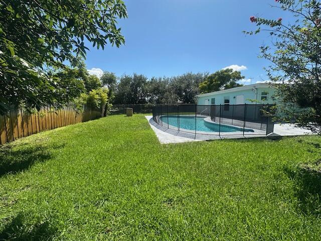 1910 SE Rainier Rd, Port Saint Lucie, FL 34952 - view of fenced backyard