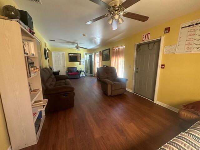 1910 SE Rainier Rd, Port Saint Lucie, FL 34952 - living room featuring wood finished floors and a ceiling fan
