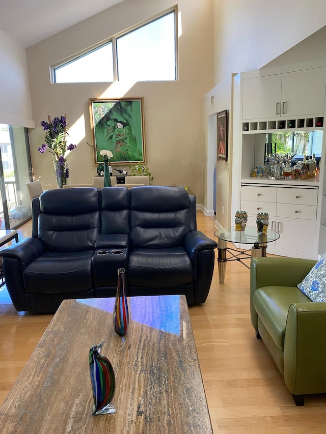 6864 Willow Wood Dr Unit 408, Boca Raton, FL 33434 - living area featuring a high ceiling and light wood-type flooring