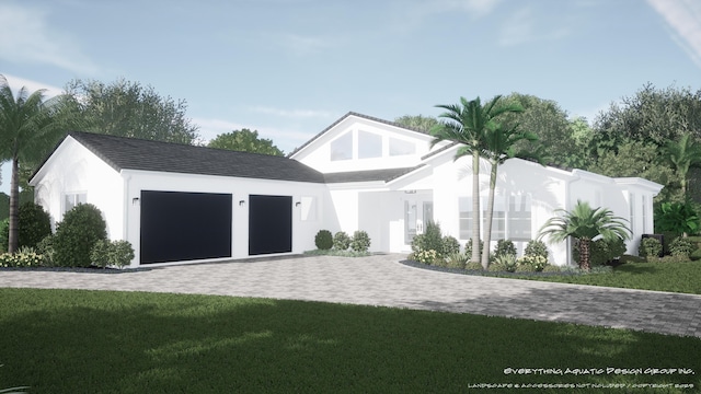 6189 Woodcutter Ct, Palm Beach Gardens, FL 33418 - view of front of house with decorative driveway, a front yard, an attached garage, and stucco siding
