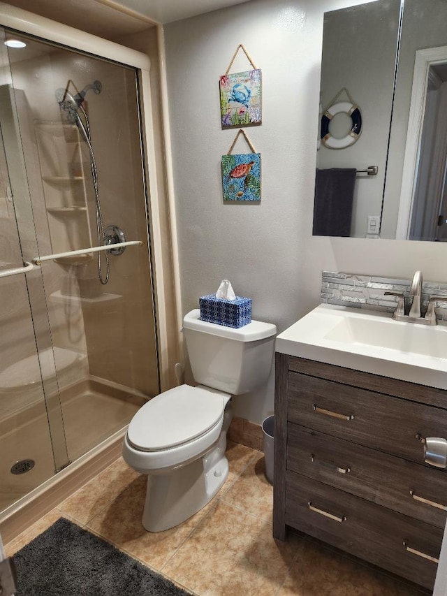131 Doolen Ct Unit 302, North Palm Beach, FL 33408 - bathroom featuring vanity, a stall shower, and tile patterned floors