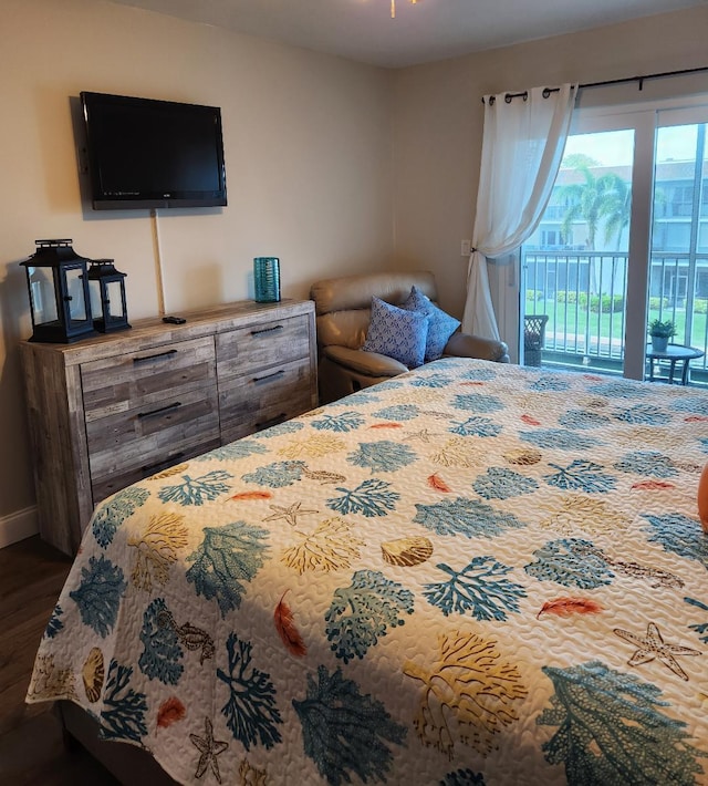 131 Doolen Ct Unit 302, North Palm Beach, FL 33408 - bedroom with access to exterior and wood finished floors