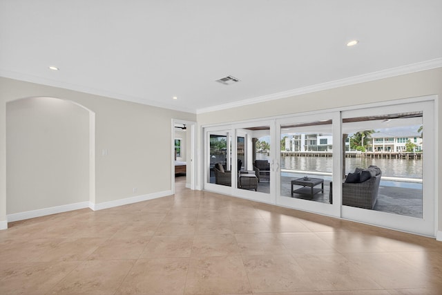 1921 W Terra Mar Dr, Lauderdale By The Sea, FL 33062 - spare room with crown molding, arched walkways, a water view, recessed lighting, and light tile patterned floors